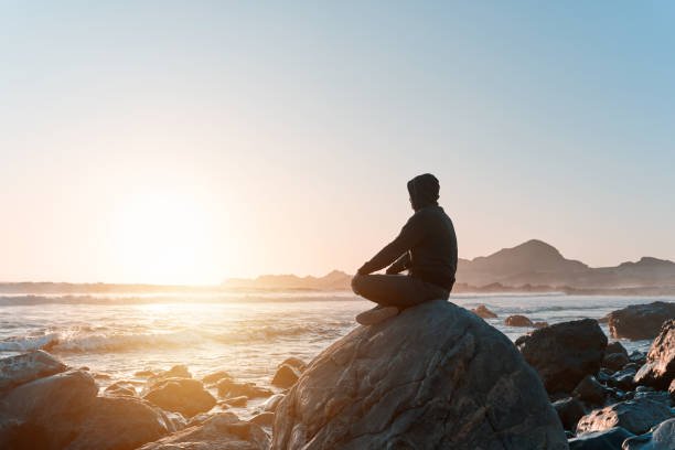 Person meditating, symbolizing mental wellness